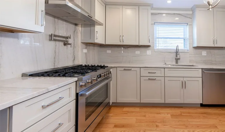 White kitchen, stainless range