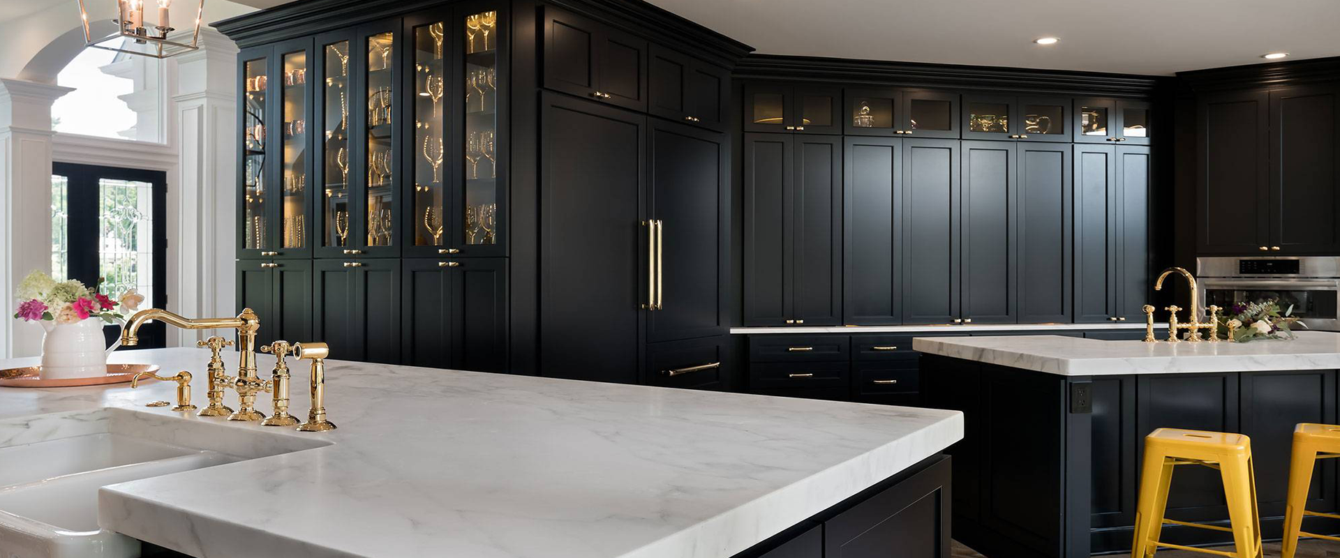 Black cabinets, marble + brass