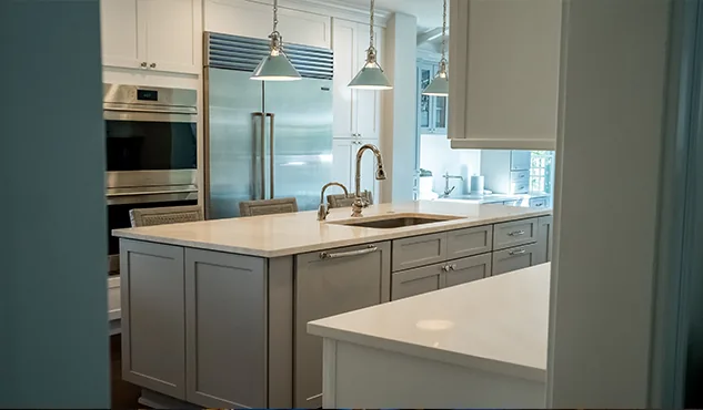 White kitchen + brass island